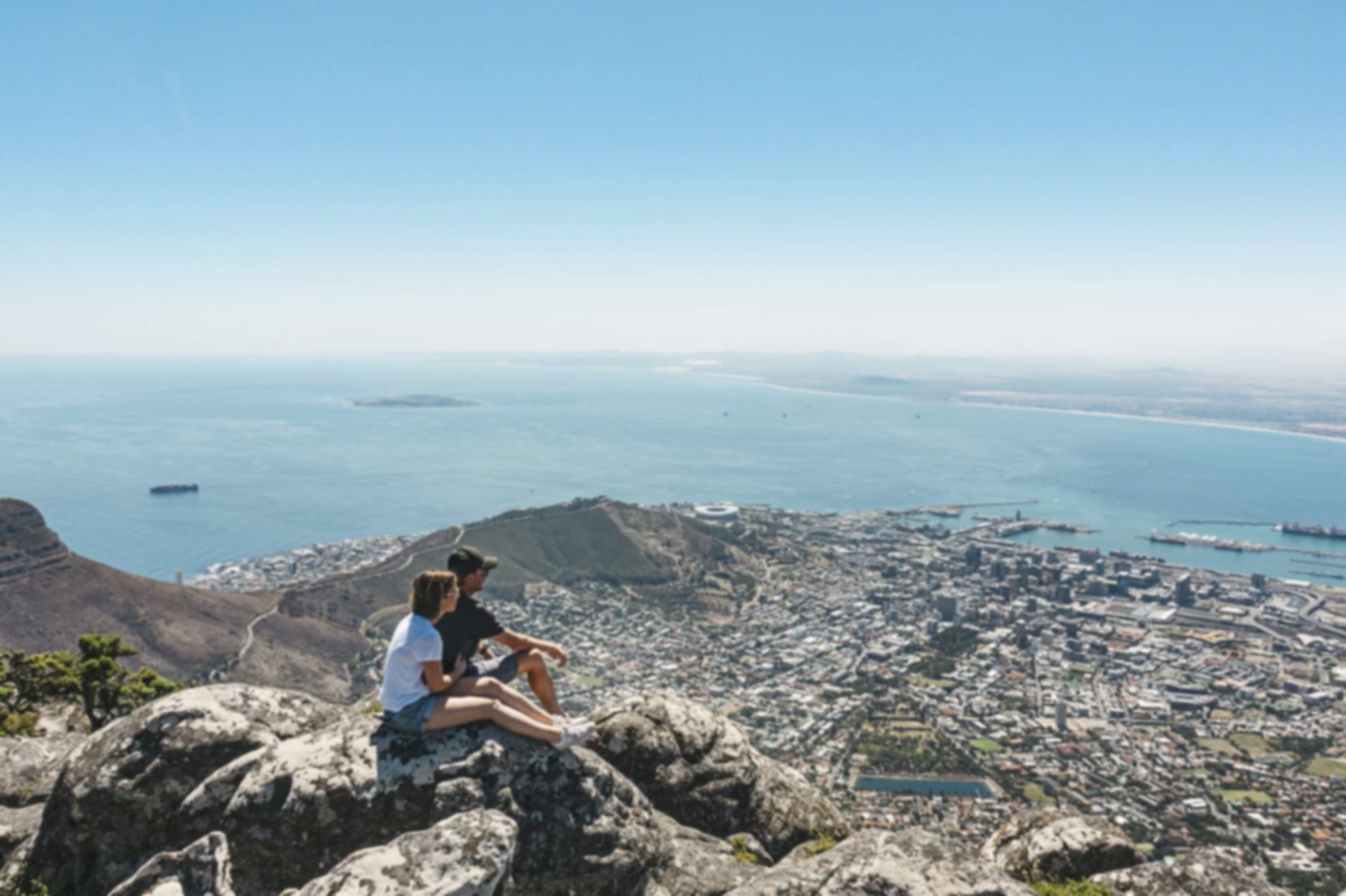 Couple taking in the view of Cape Town from Table Mountain