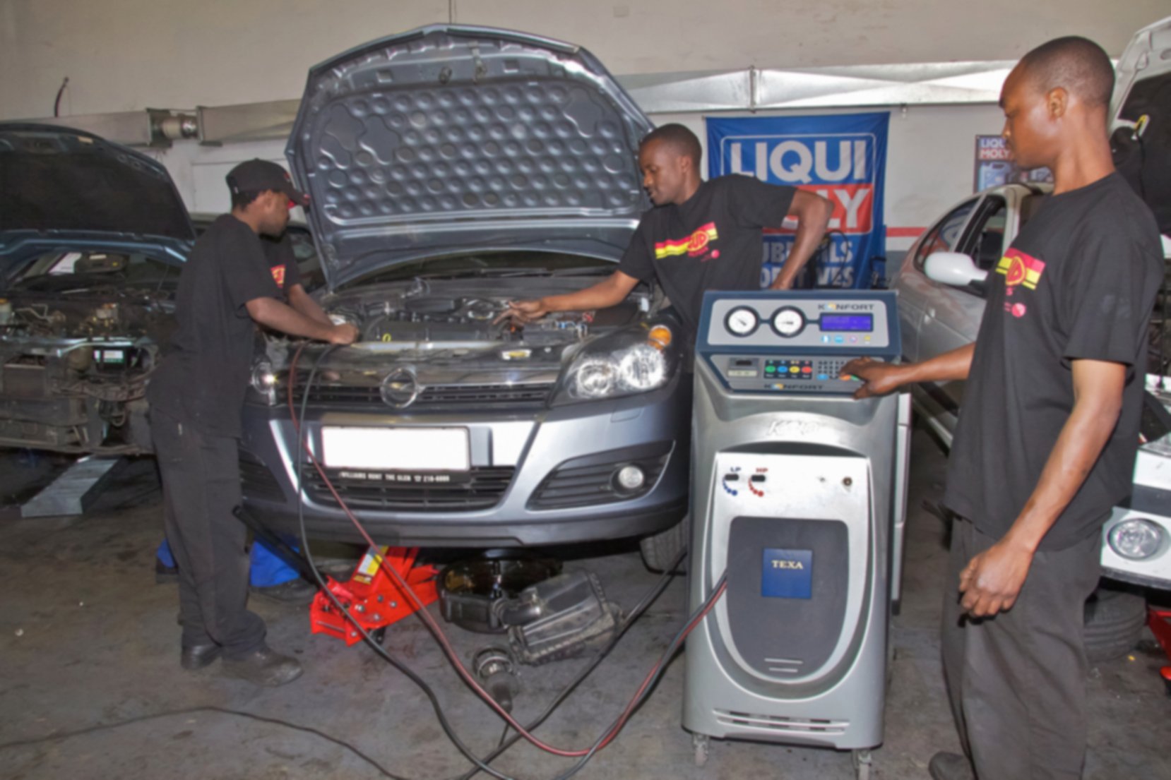 Mechanics repairing a car in Johannesburg, South Africa