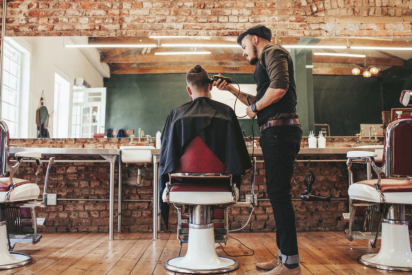 Barber cutting a customer's hair
