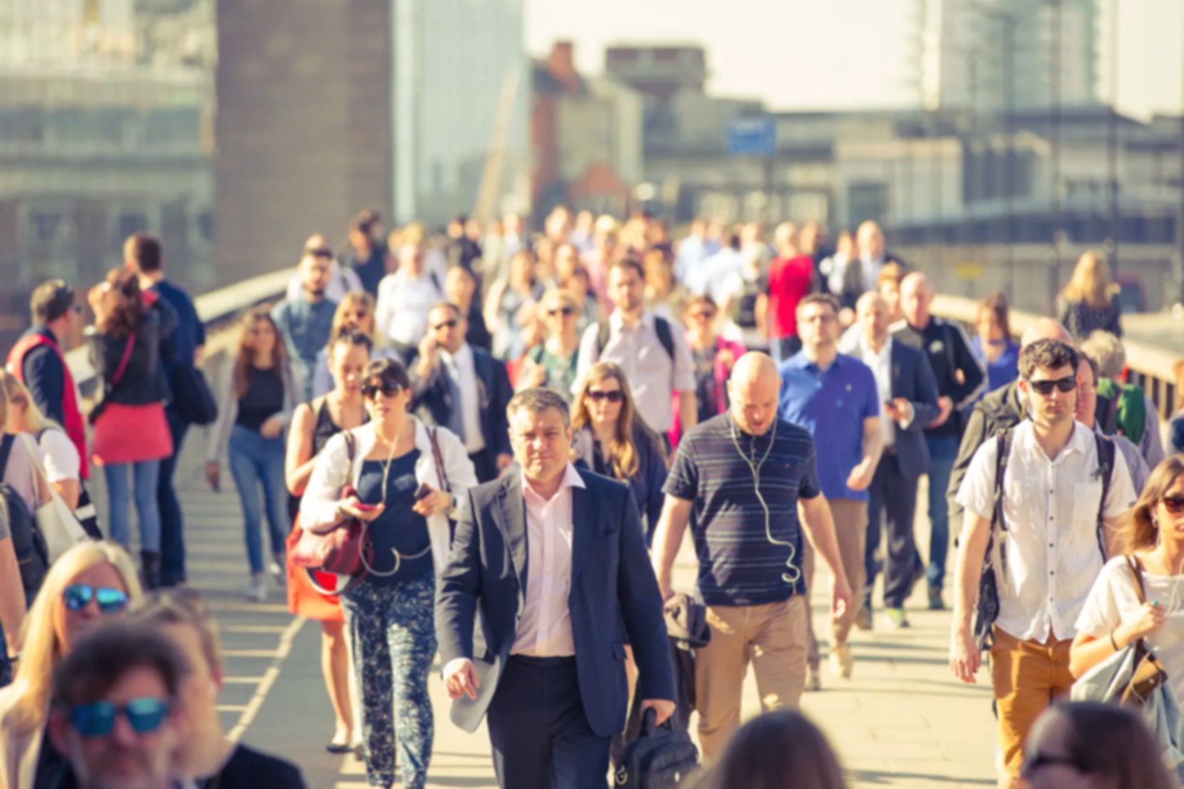 Office workers crossing London Bridge